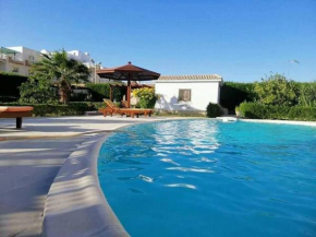 One room in a compound with the swimming pool